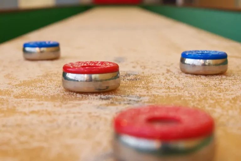 a closeup photo of a shuffleboard table